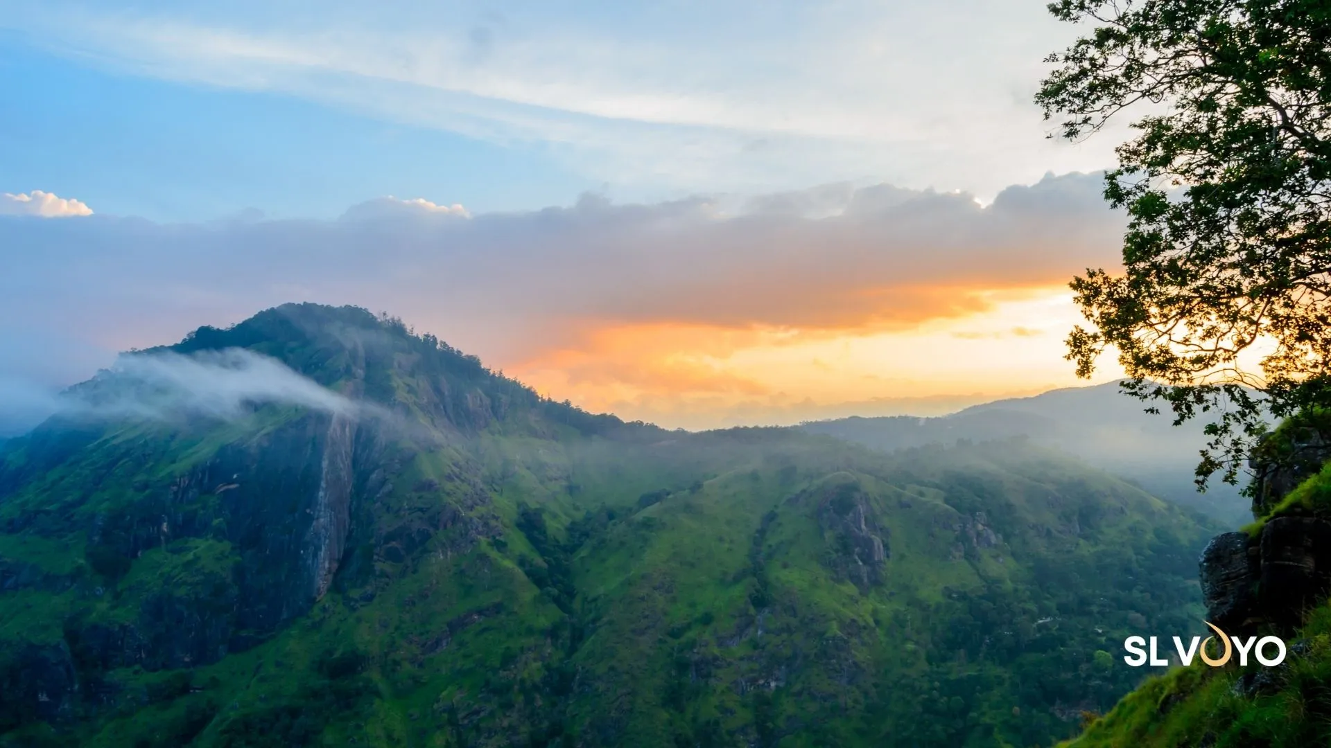View from Ella Rock hike overlooking hills, valleys, and waterfalls in Sri Lanka