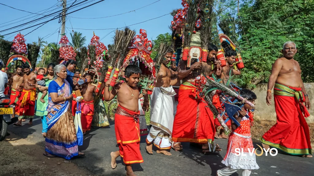 Hindu devotees carrying colourful Kavadi