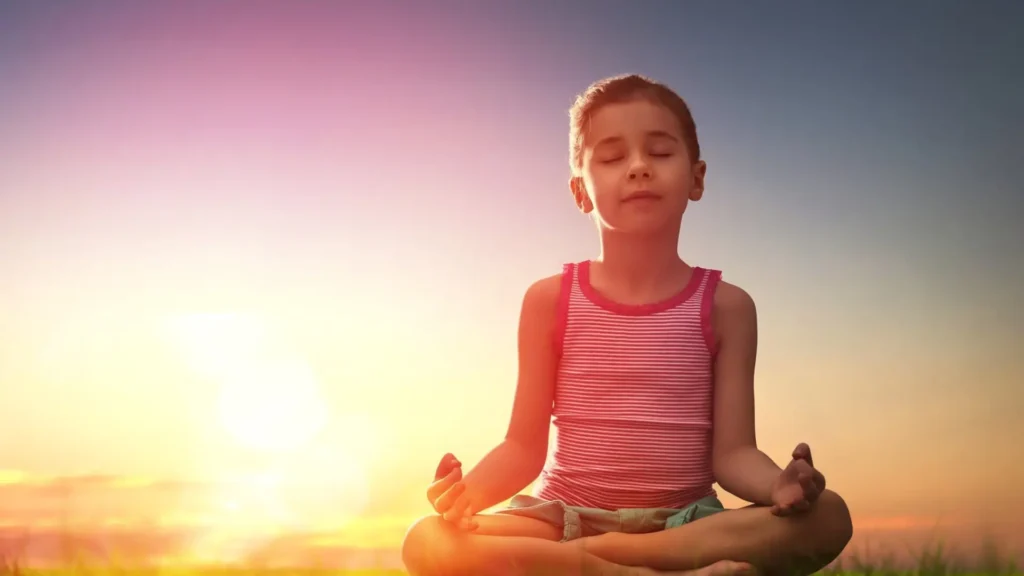 Young students practising meditation