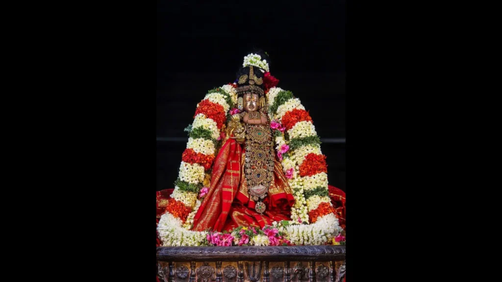 Statue of Andal Amman decorated with flower garlands