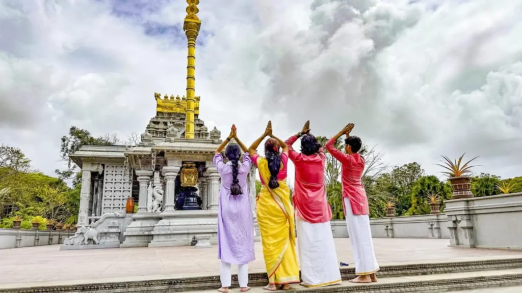 Visitors observing Hindu religious ceremonies